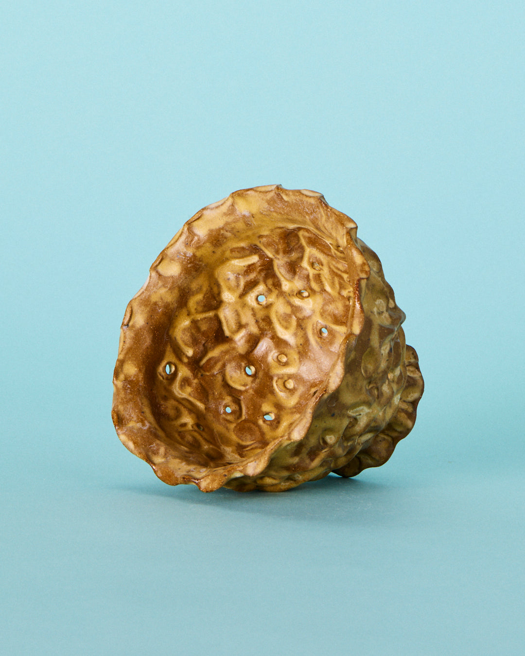 brown strainer berry bowl