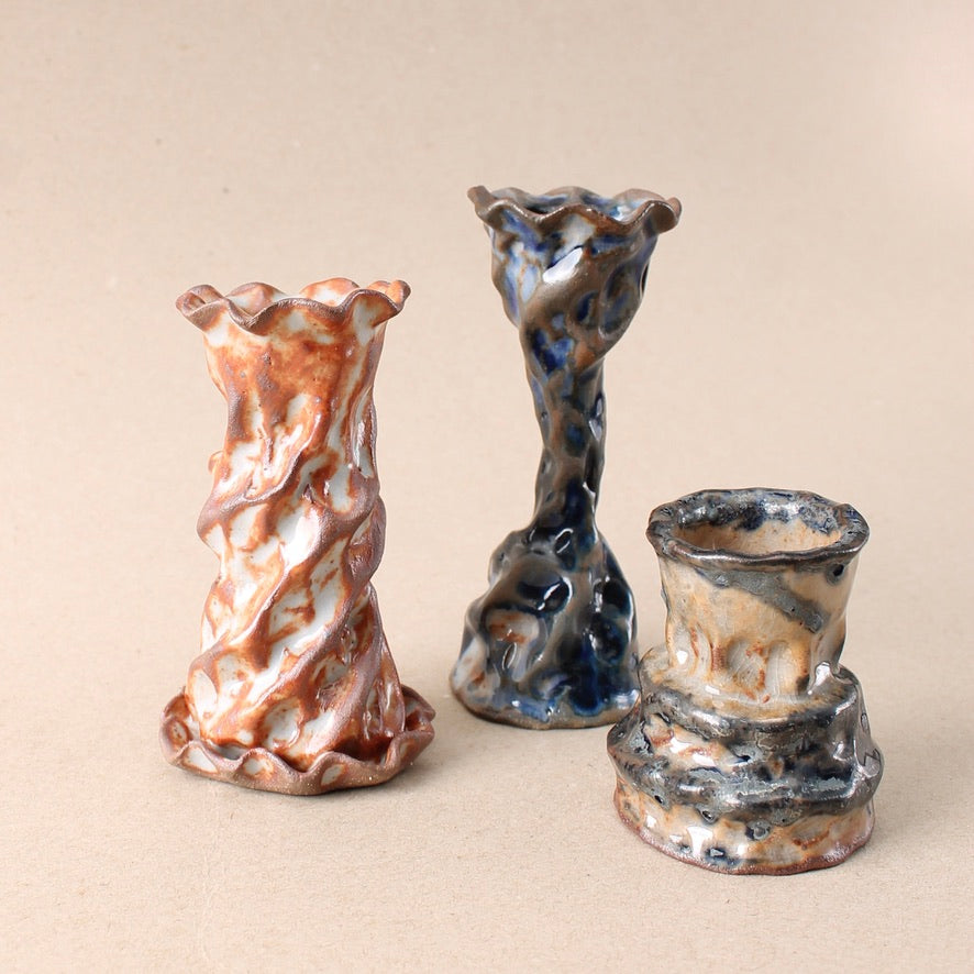 dark blue candlestick trio