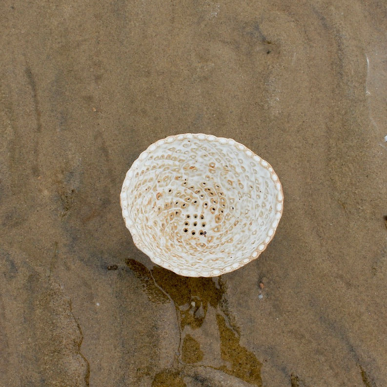 brown strainer bowl