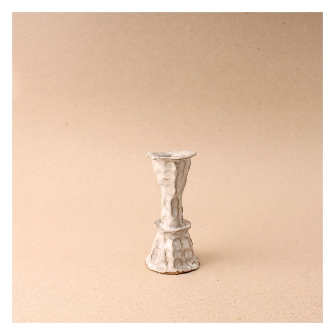 white pinch candlestick