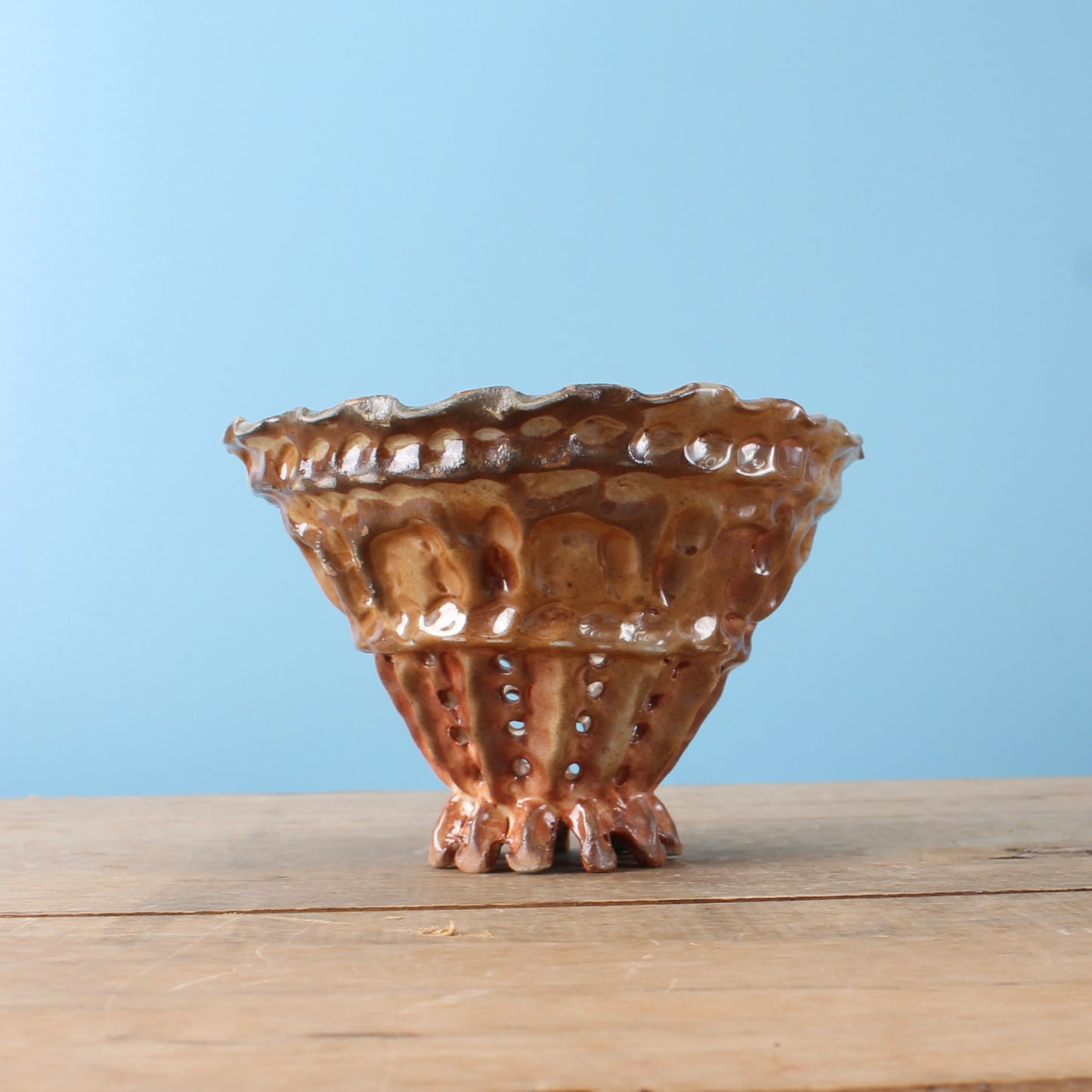 metallic brown strainer bowl