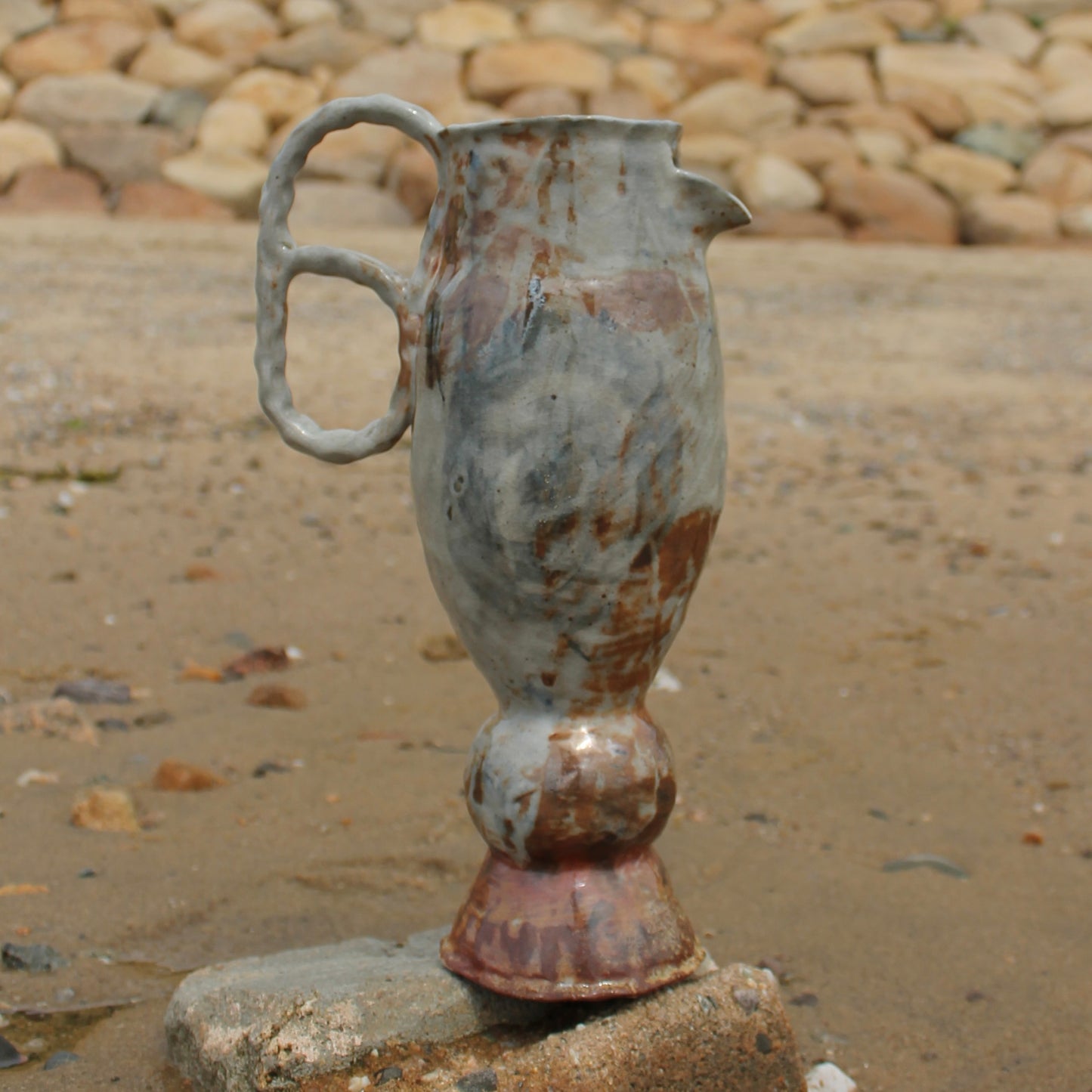 pedestal loop pitcher