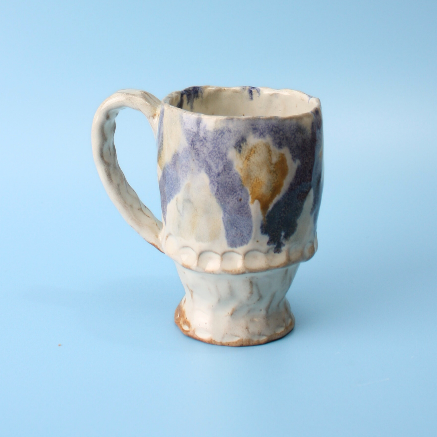 white and blue mug
