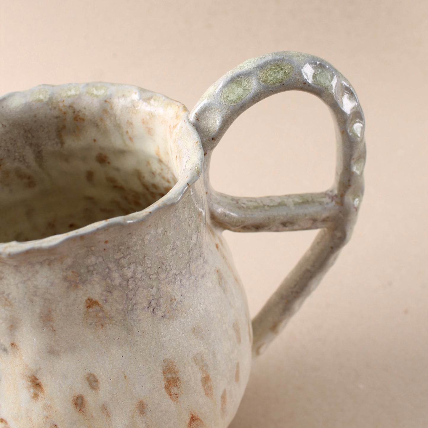 tan loop pitcher