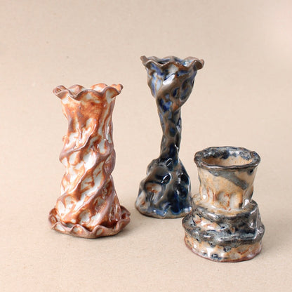 dark blue candlestick trio