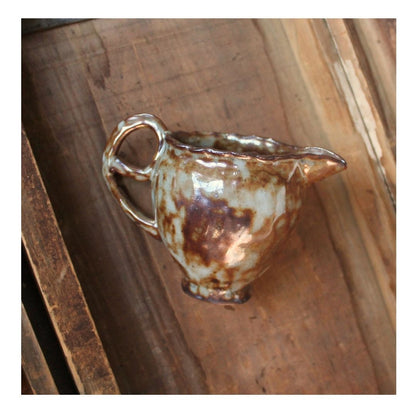 brown small pitcher