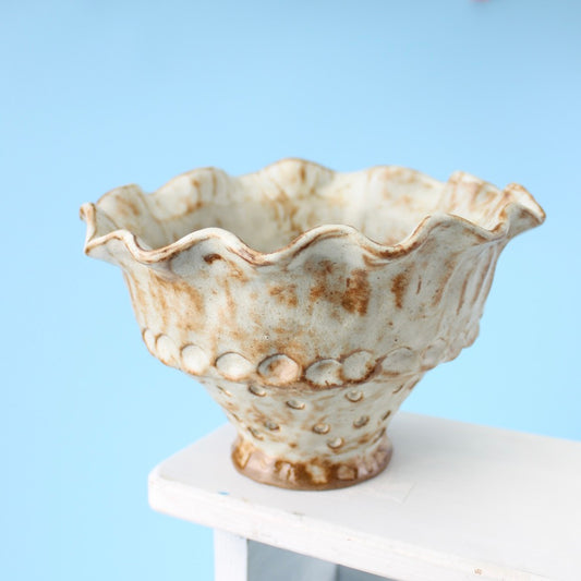 white strainer berry bowl