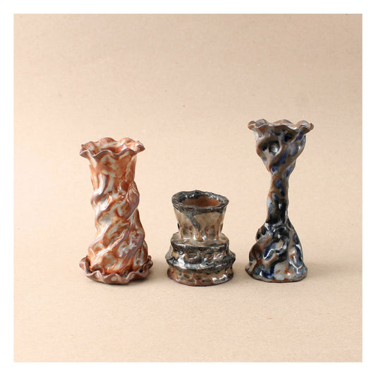 dark blue candlestick trio