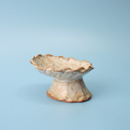 tan pedestal dish