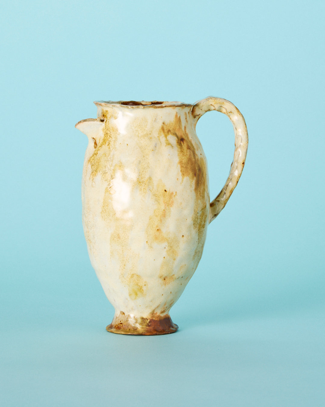 yellow painted pitcher
