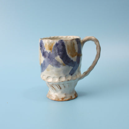 white and blue mug