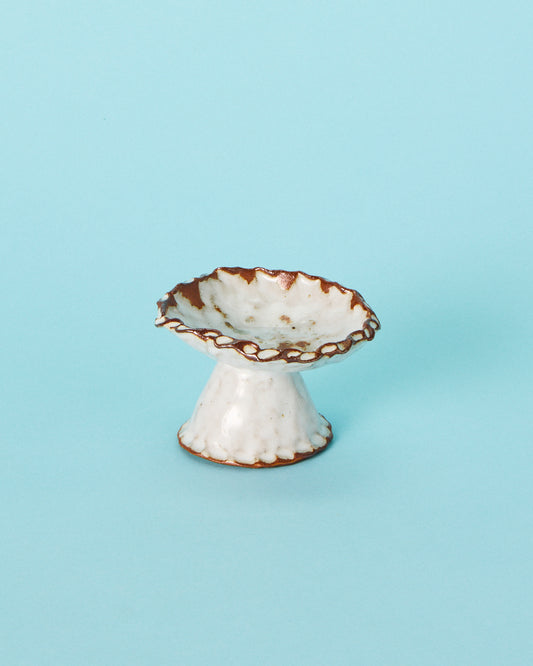 white pedestal dish