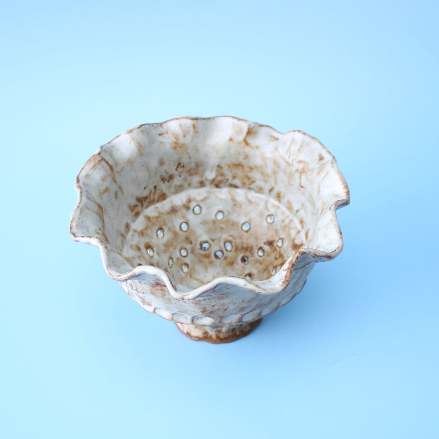 white strainer berry bowl