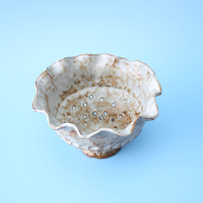 white strainer berry bowl