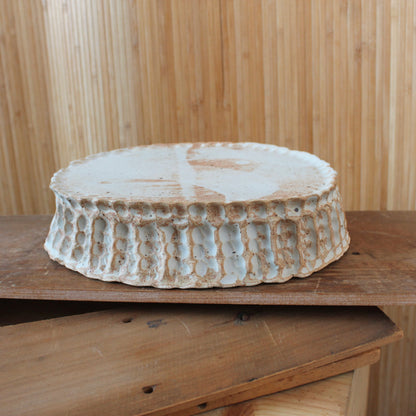 large beige pedestal