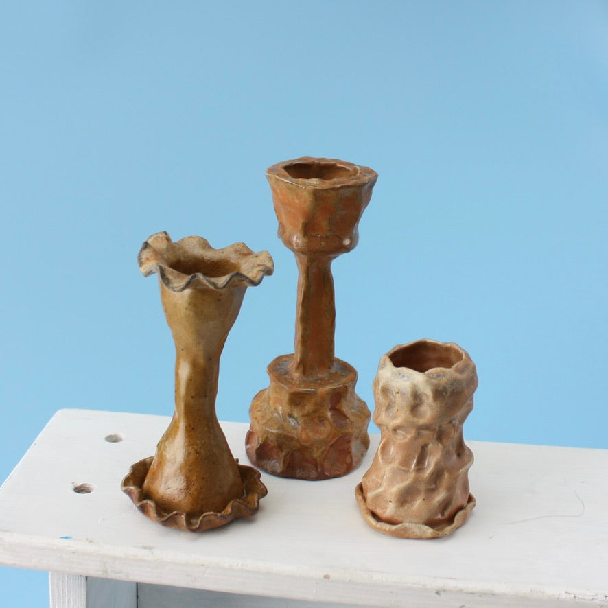 orange candlestick trio