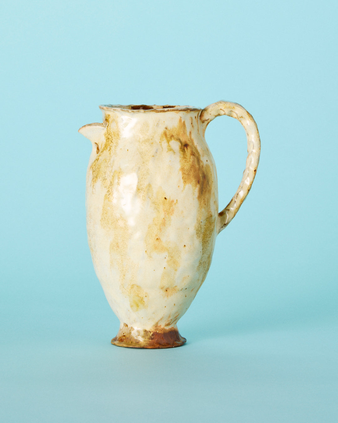 yellow painted pitcher