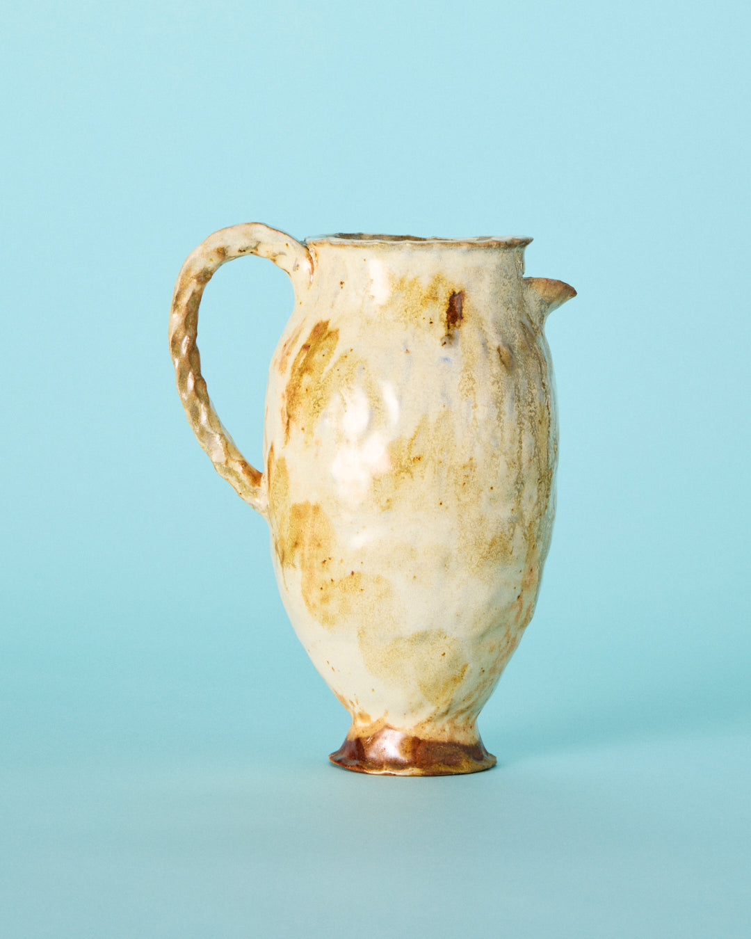 yellow painted pitcher