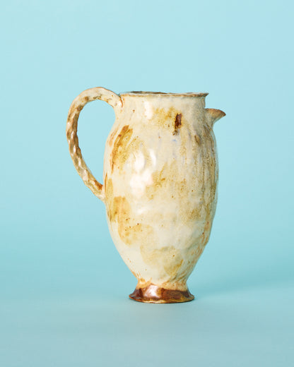 yellow painted pitcher