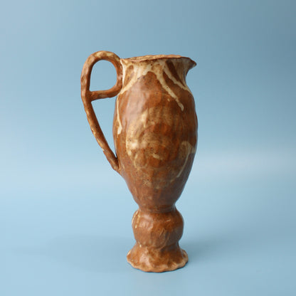 small brown pedestal pitcher