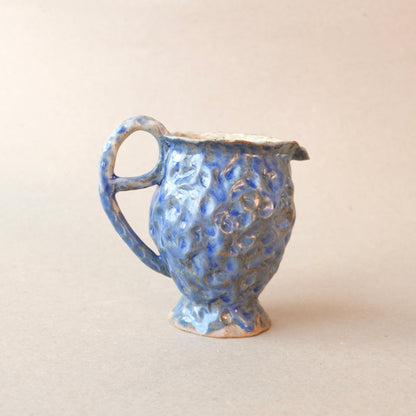 small blue pitcher