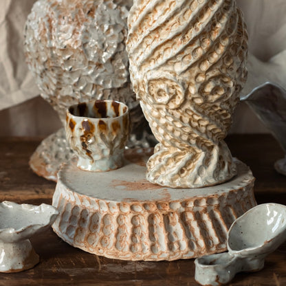 large beige pedestal