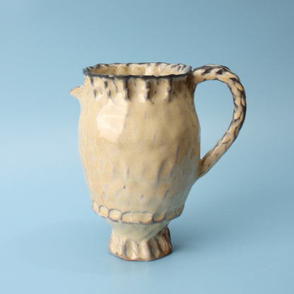 small yellow pitcher