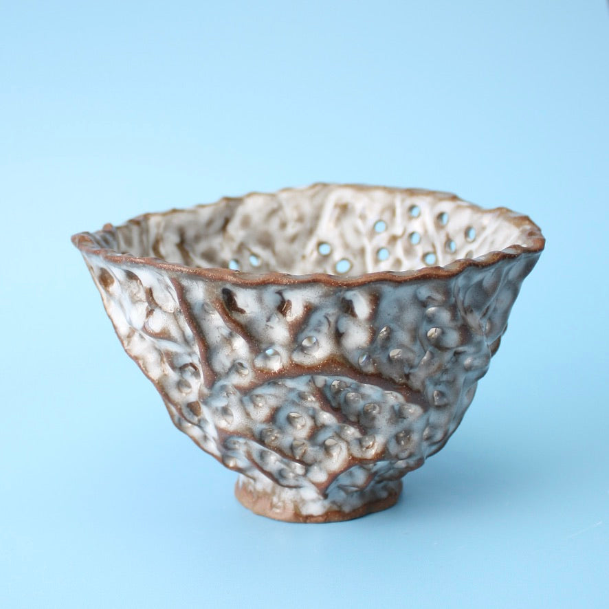 brown strainer berry bowl