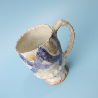 white and blue mug