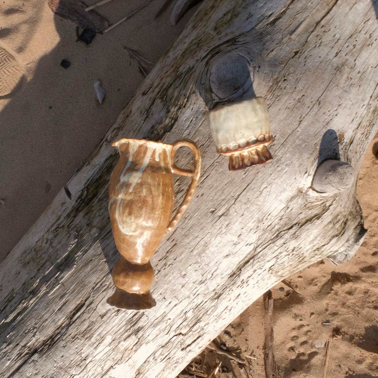 small brown pedestal pitcher