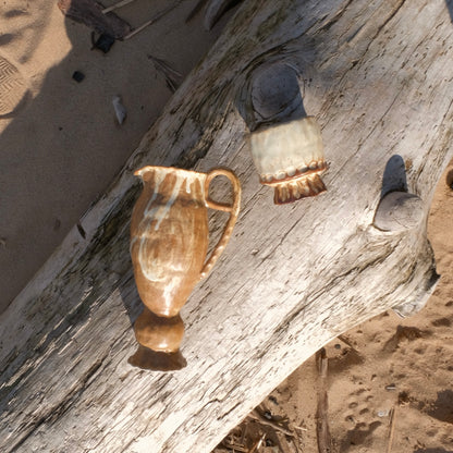 small brown pedestal pitcher