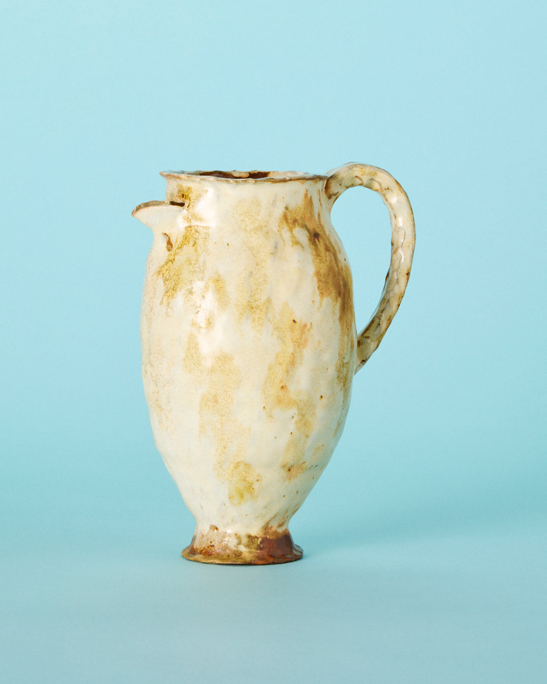 yellow painted pitcher