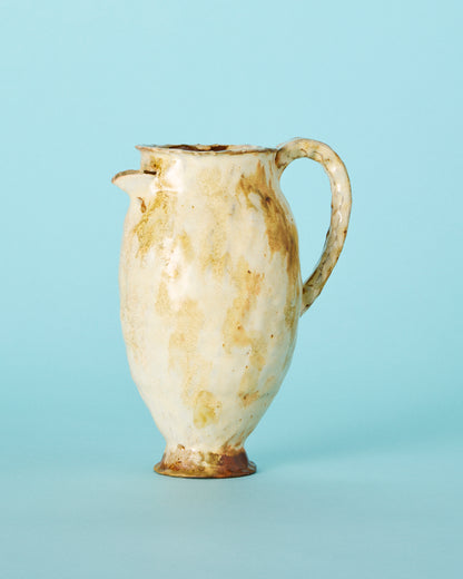 yellow painted pitcher