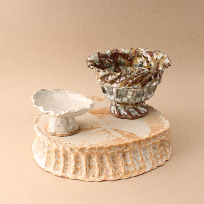 large beige pedestal